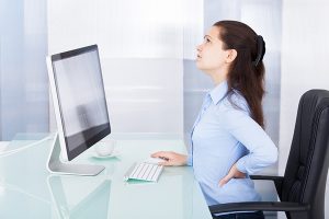 girl on computer, back pain, chairs, office, posture