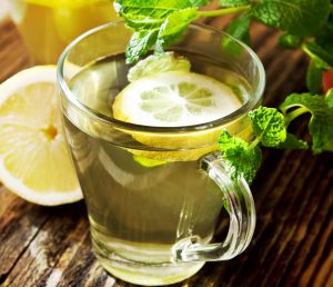 green tea with lemon in clear glass, hydration