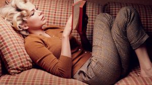 girl on couch reading, book